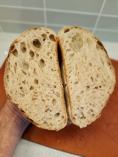 The rise lifted a 777g lid about 2mm. Final loaf weight is 1041g. White  whole wheat, AP and bread flour. Sourdough starter. : r/Sourdough